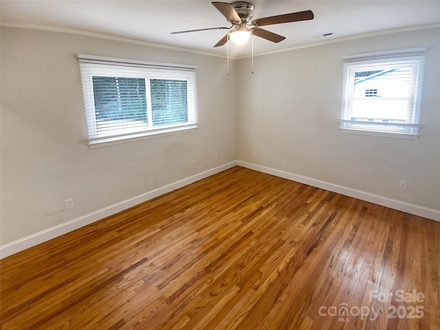 empty room featuring crown molding, ceiling fan, and hardwood / wood-style flooring