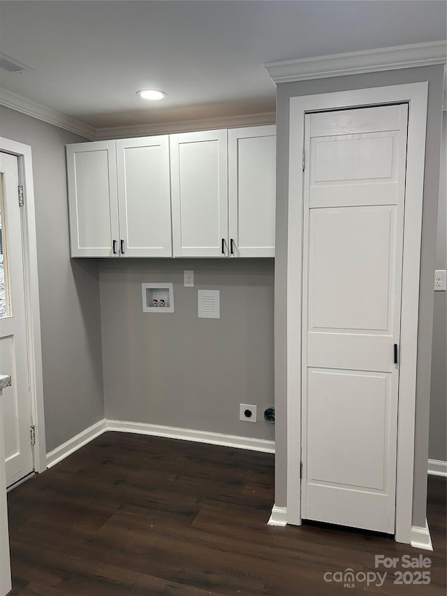 laundry area with dark wood-style floors, washer hookup, cabinet space, ornamental molding, and baseboards