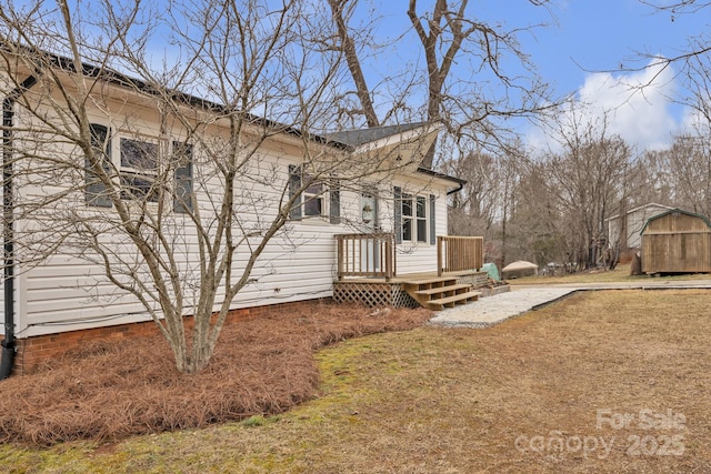 exterior space featuring a storage unit and a front lawn