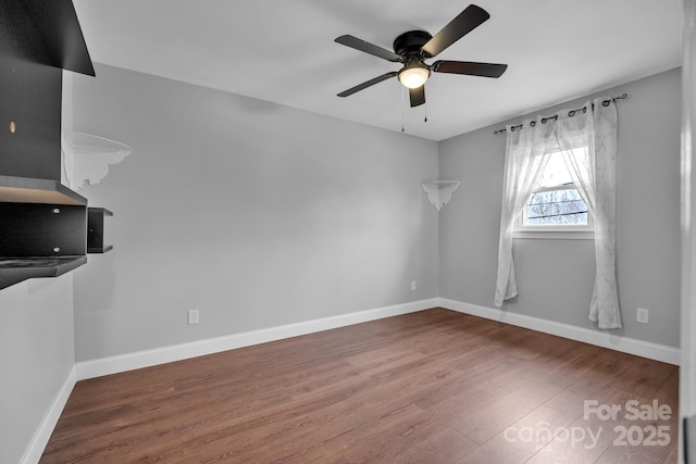 unfurnished room featuring ceiling fan and wood-type flooring