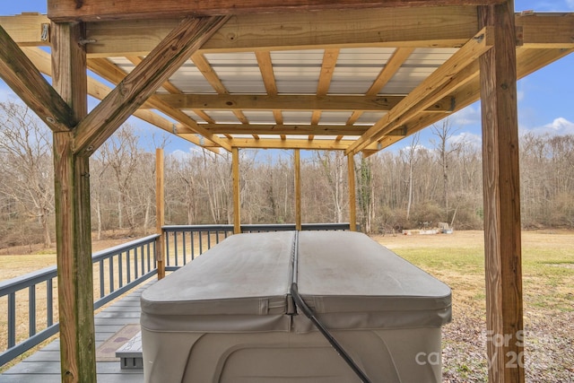 wooden deck featuring a hot tub