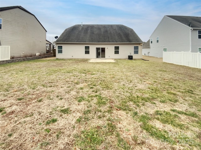 back of house featuring a yard, a patio, and central air condition unit