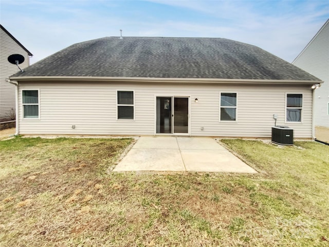 back of property featuring a yard, central AC unit, and a patio area