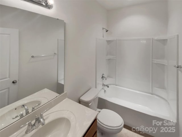 full bathroom featuring bathing tub / shower combination, vanity, and toilet