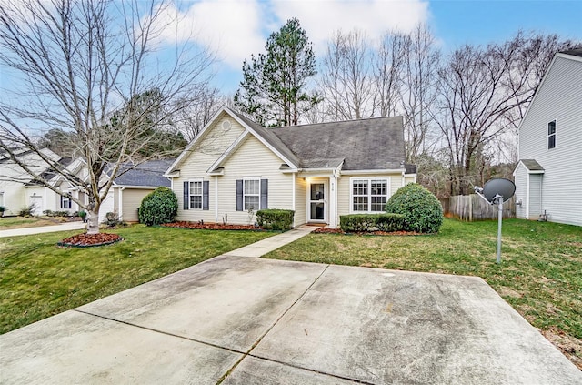 single story home featuring a front lawn