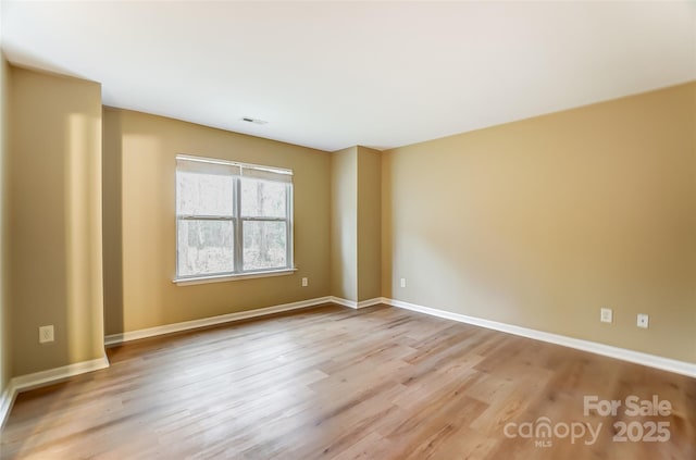 unfurnished room featuring light wood-type flooring