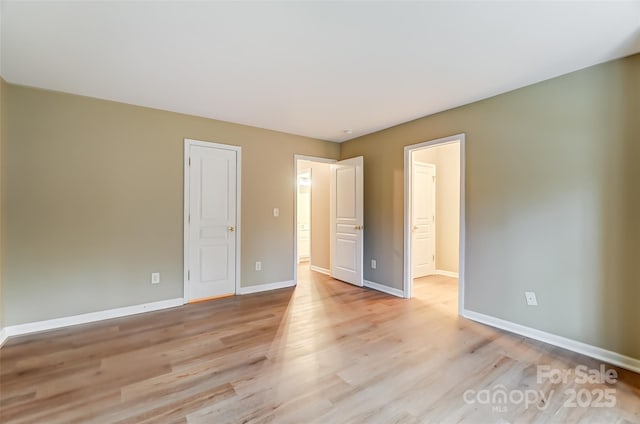 unfurnished bedroom with light wood-type flooring