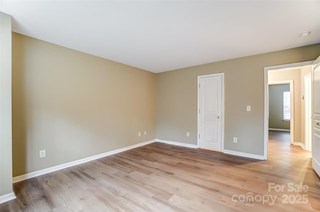 unfurnished room with light hardwood / wood-style flooring