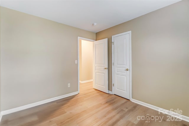 unfurnished bedroom with light hardwood / wood-style flooring