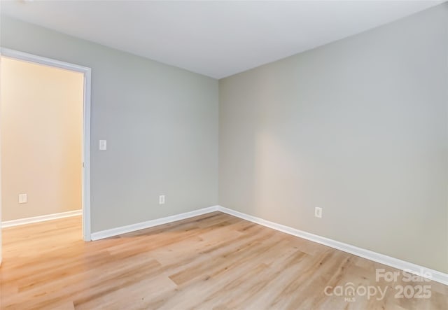 spare room with light wood-type flooring