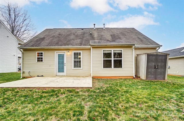 rear view of property featuring a yard and a patio area