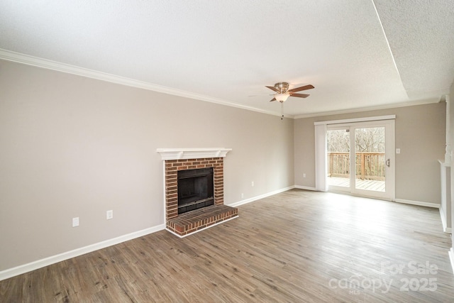 unfurnished living room featuring a fireplace, ornamental molding, ceiling fan, light hardwood / wood-style floors, and a textured ceiling