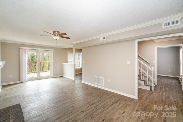 unfurnished living room with a textured ceiling, ornamental molding, dark hardwood / wood-style floors, and ceiling fan