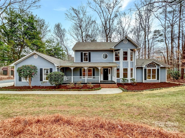 view of front of home featuring a porch and a front lawn