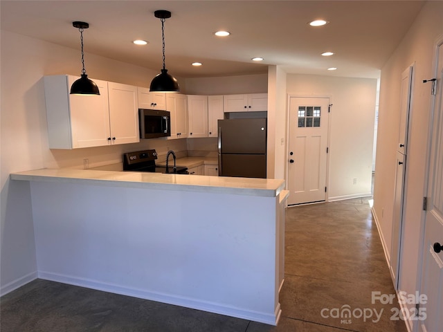 kitchen featuring hanging light fixtures, white cabinetry, kitchen peninsula, and black appliances