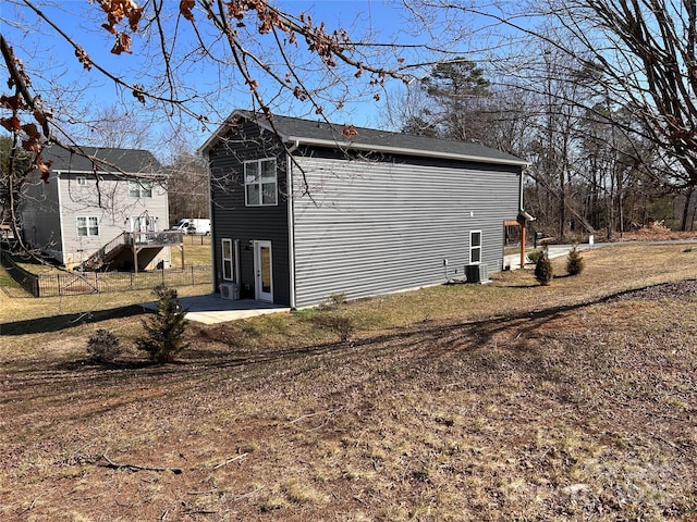 view of home's exterior with a patio and central AC