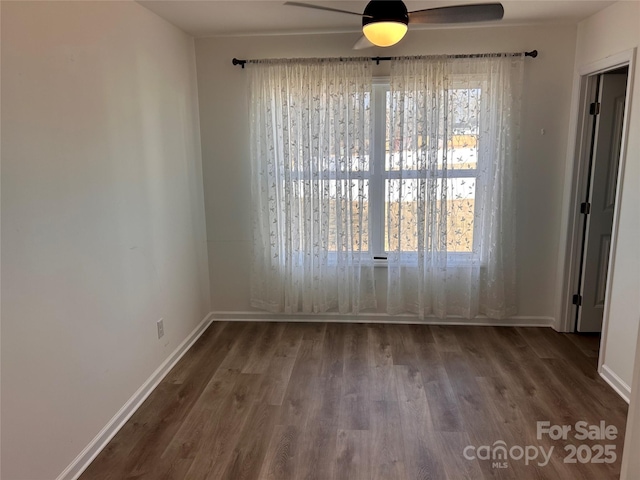 spare room with ceiling fan and wood-type flooring