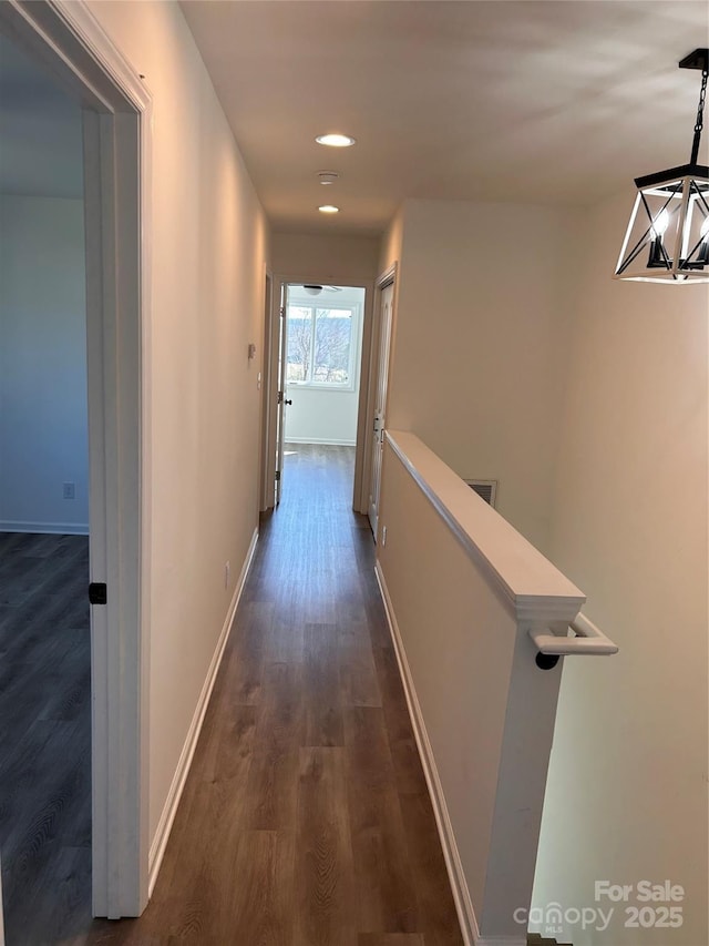 hallway with dark wood-type flooring