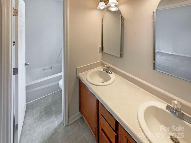 full bathroom with vanity, washtub / shower combination, and toilet