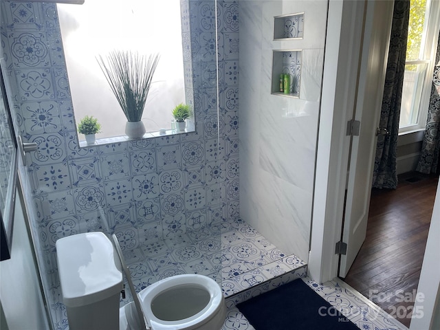 bathroom featuring hardwood / wood-style floors and toilet