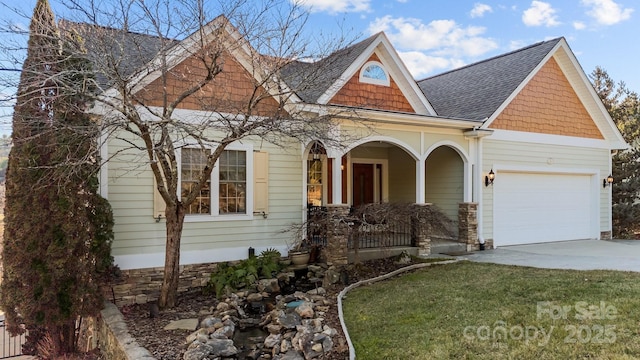 view of front of home with a garage and a porch