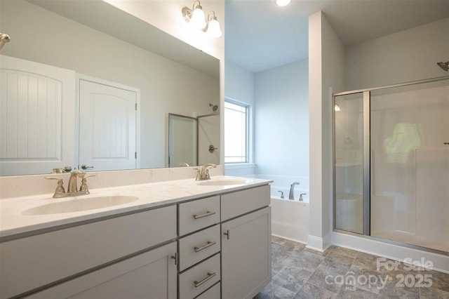 bathroom featuring shower with separate bathtub and vanity