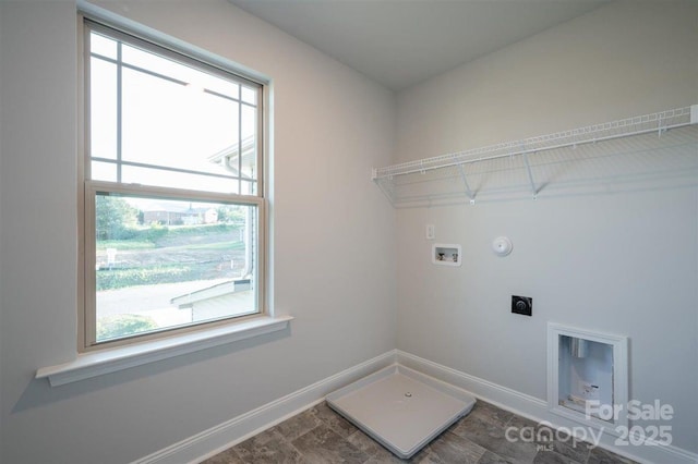 washroom with hookup for a gas dryer, hookup for a washing machine, and hookup for an electric dryer