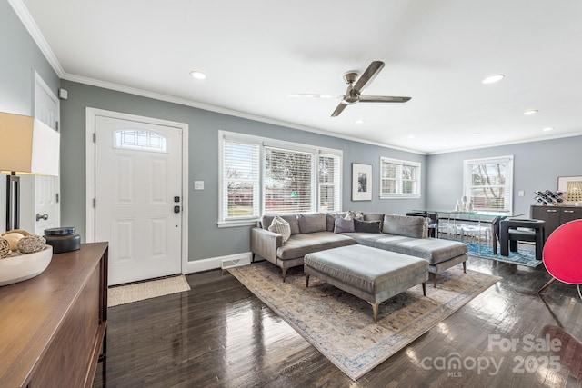 living room with ornamental molding, dark hardwood / wood-style floors, and ceiling fan