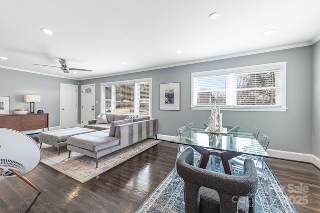 bedroom featuring dark wood-type flooring, ceiling fan, and ornamental molding