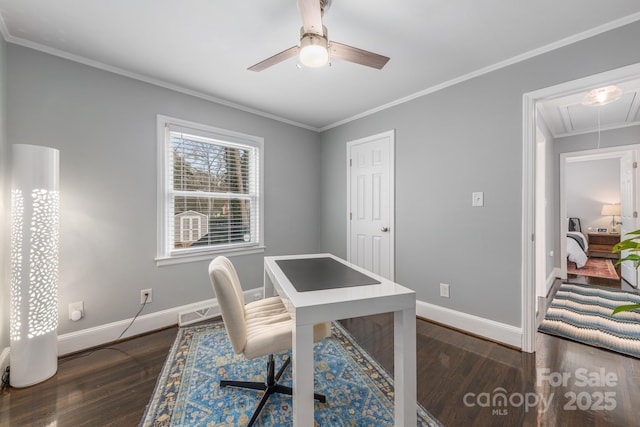 office space featuring ornamental molding, dark wood-type flooring, and ceiling fan