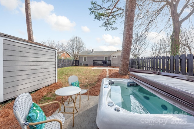 view of patio with a hot tub