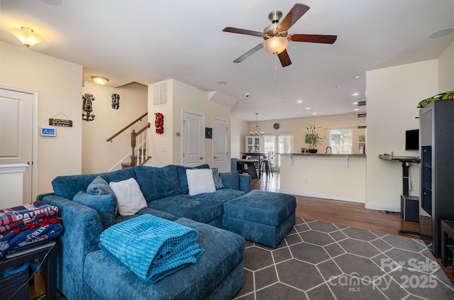 living room with dark wood-style flooring, visible vents, stairway, recessed lighting, and a ceiling fan