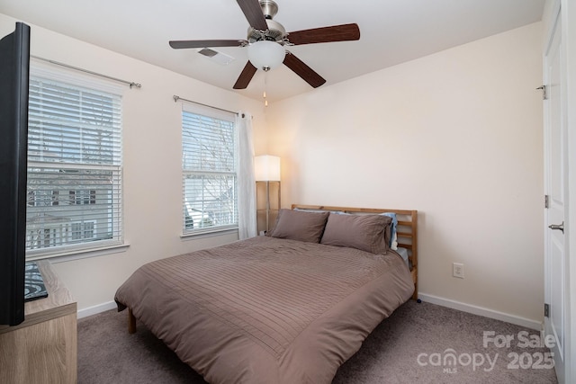 carpeted bedroom featuring ceiling fan, baseboards, and visible vents