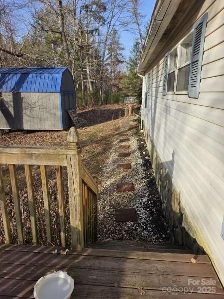 wooden terrace with a storage unit