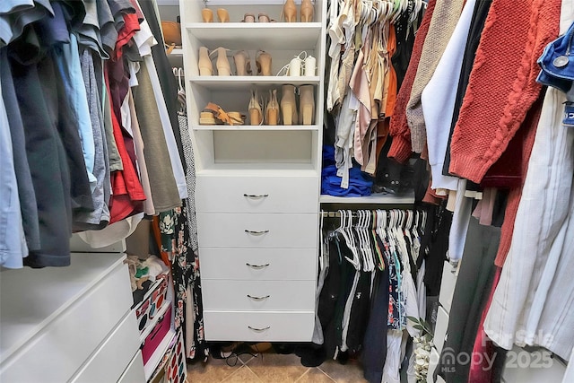 walk in closet featuring light tile patterned floors