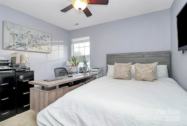 bedroom featuring carpet floors, visible vents, and a ceiling fan