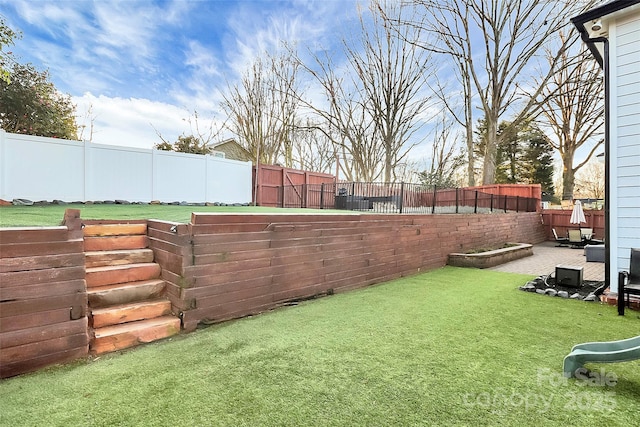 view of yard with a fenced backyard