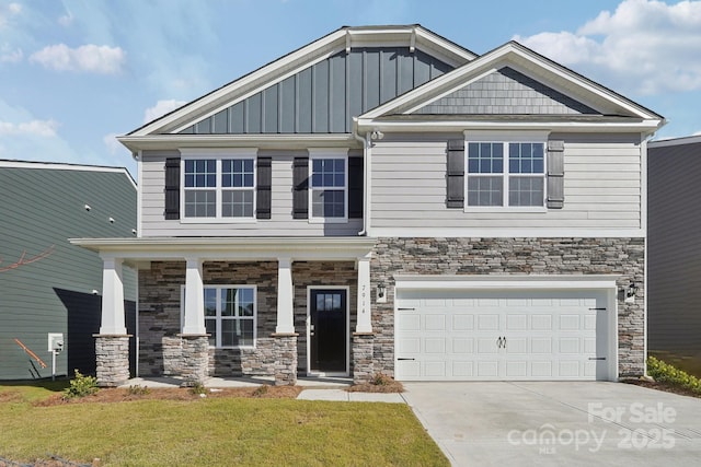 craftsman-style house featuring a porch, a garage, and a front yard