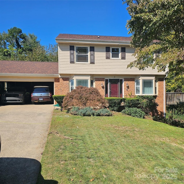 view of front of house featuring a garage and a front lawn