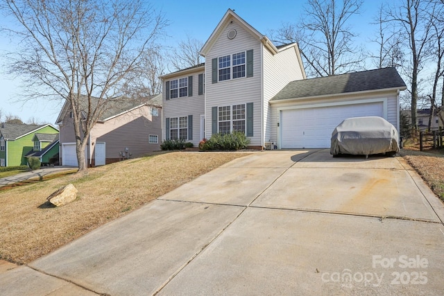 view of front of house with a garage and a front yard