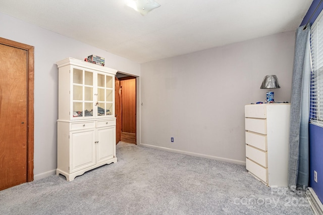 bedroom with light carpet