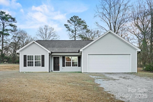 single story home featuring a garage and a front yard