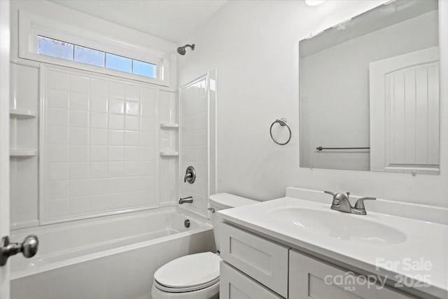 full bathroom featuring vanity, toilet, and washtub / shower combination