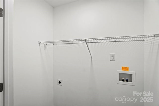 washroom with hookup for an electric dryer and hookup for a washing machine