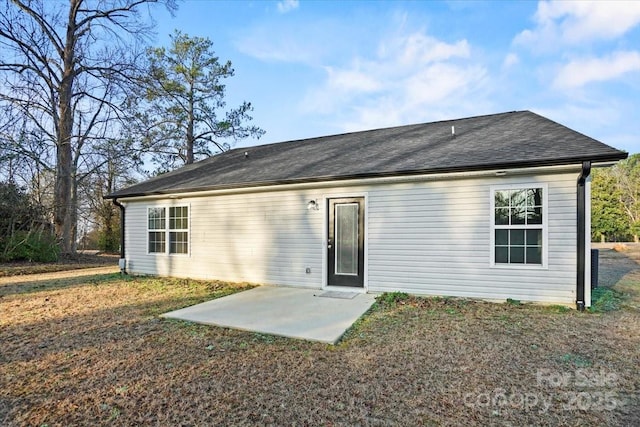 back of property with a patio