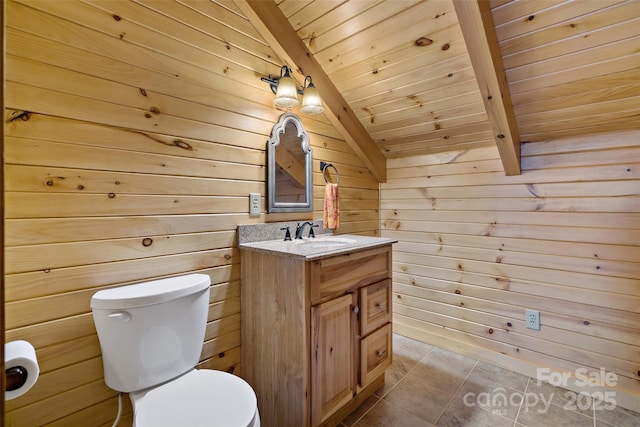 bathroom featuring lofted ceiling with beams, wooden ceiling, toilet, wood walls, and vanity