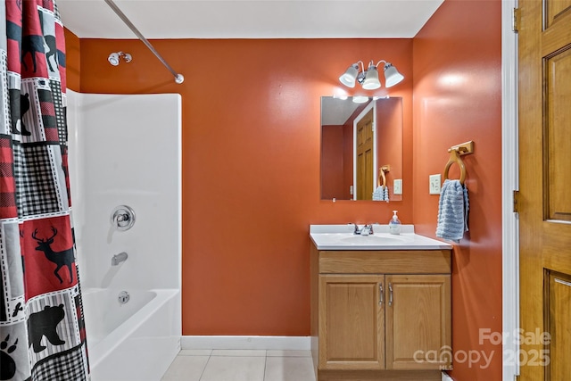 bathroom featuring baseboards, shower / bathtub combination with curtain, vanity, and tile patterned floors