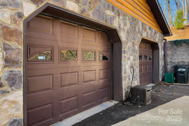 view of exterior entry featuring stone siding