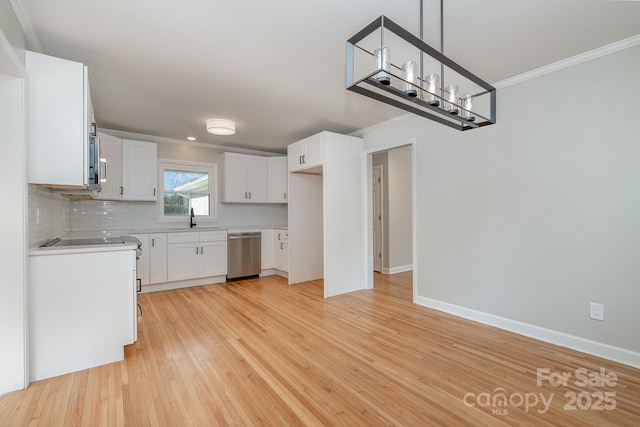 kitchen with light wood finished floors, tasteful backsplash, crown molding, stainless steel dishwasher, and a sink