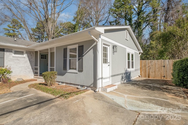 exterior space featuring crawl space and fence